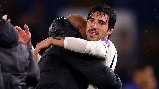 Sandro Tonali hugs a member of De Zerbi's coaching staff